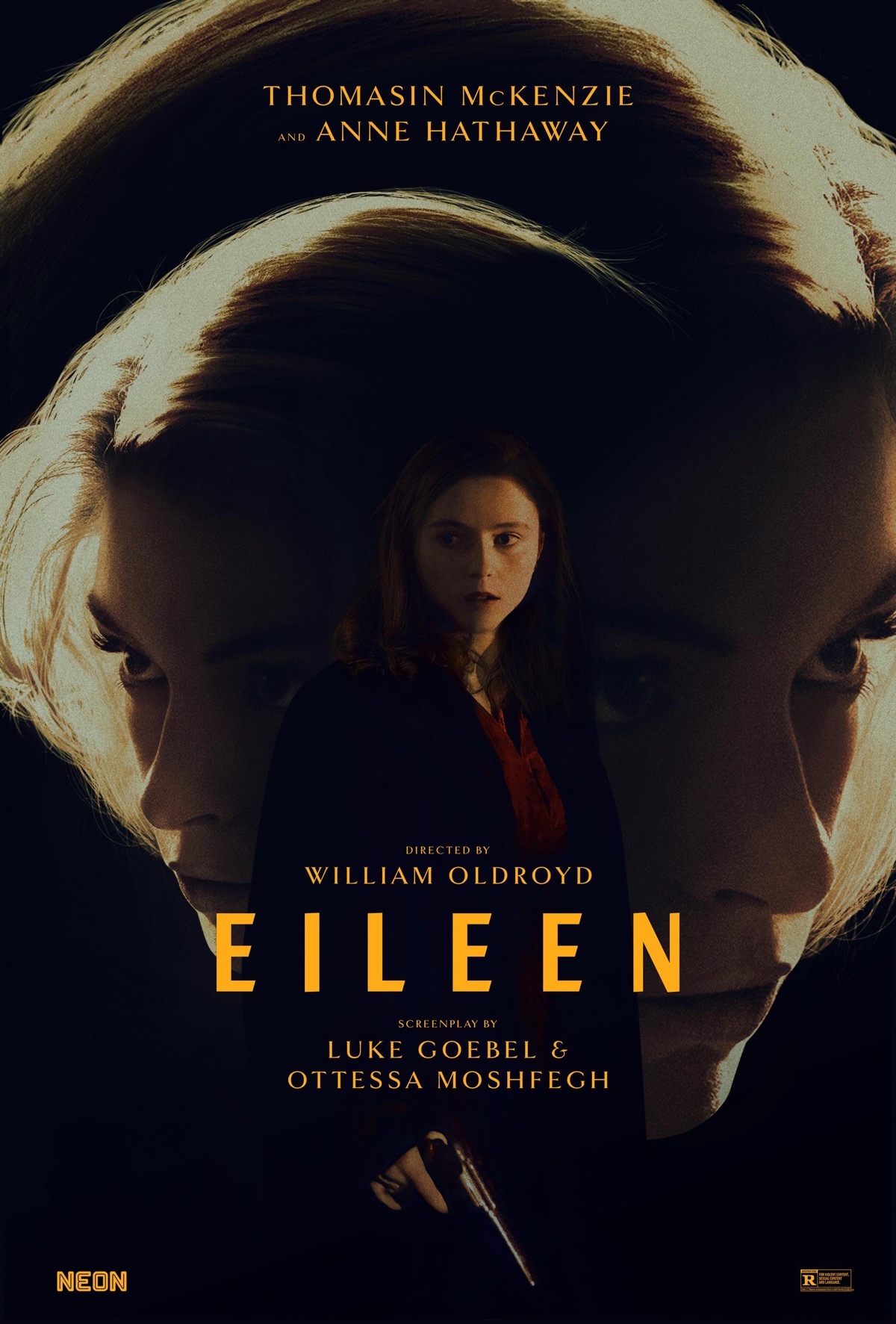 Thomasin McKenzie holding a gun looking nervous, in front of a huge image of Anne Hathaway's blonde head