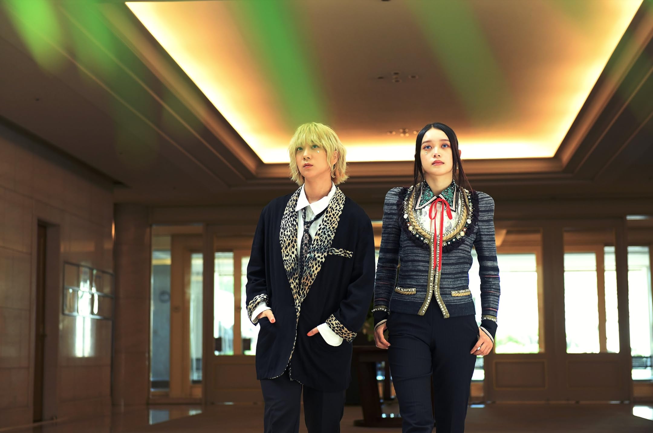 Boss Babies Two young Japanese women looking absolutely boss in suits. The blonde woman has leopard print lapels, the brunette's is latin inspired and has a red bolo tie