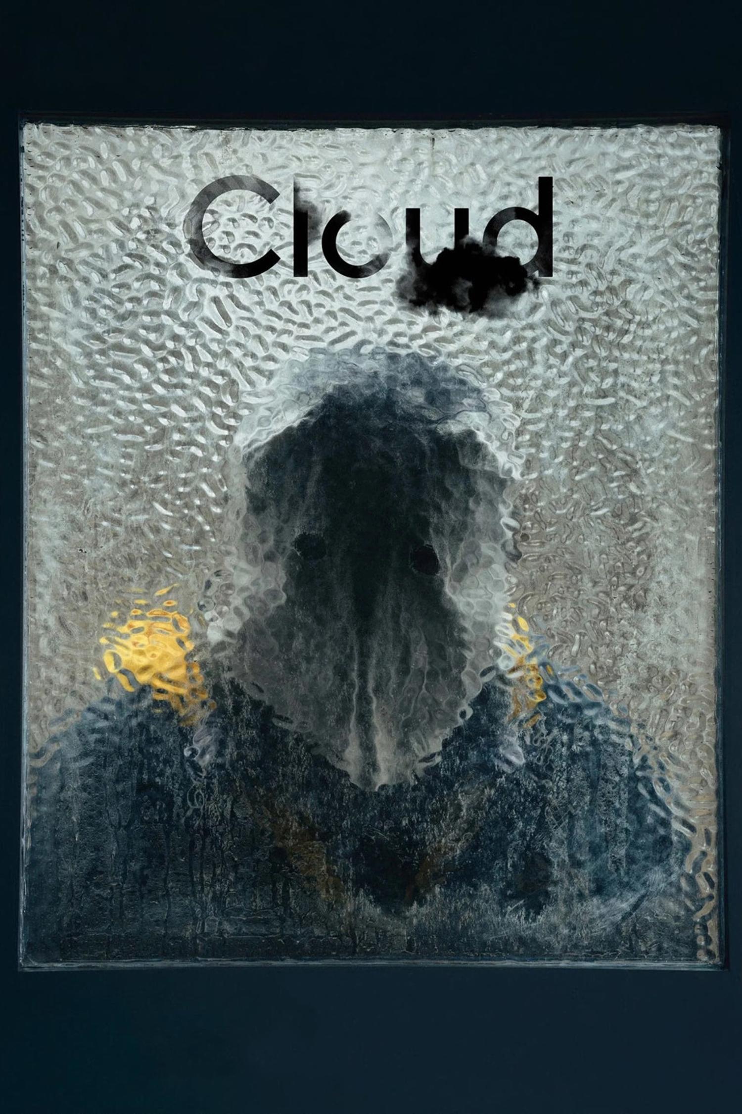 Poster for the film Cloud. Someone with a cloth bag over their head, with two dark eyeholes, stands looking through a mottled glass door window.