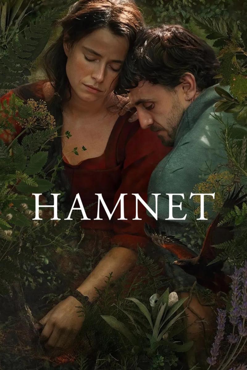 Poster for the film Hamnet. A brunette woman in a dark red dress embraces a man in an old fashioned, light blue jacket. They are both looking down in sadness and are surrounded by lush green, English forestry.