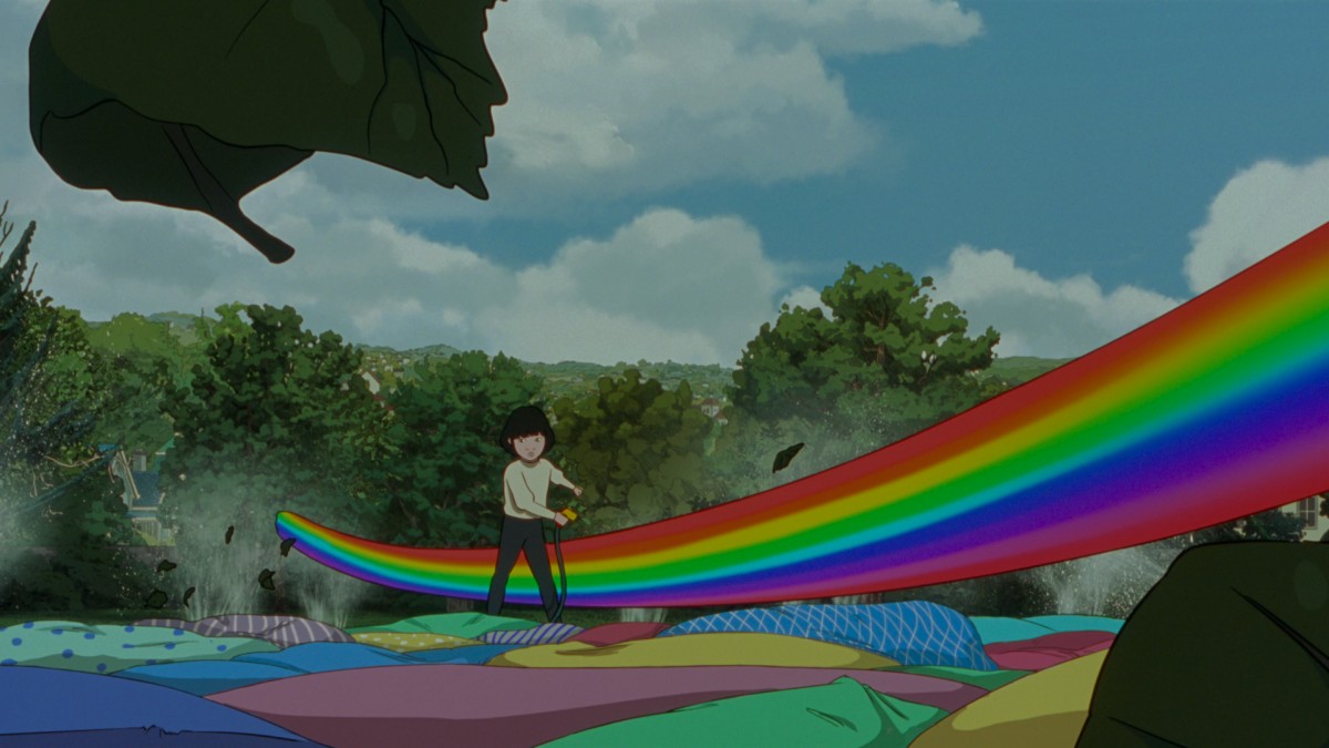 A scene from a cartoon. The floor is covered with colourful pillows, there are trees in the background and the sky is cloudy and blue. A young girl holds a garden hose as a jet of a rainbow swooshes past her, disturbing the leaves and the water from the nearby sprinklers.