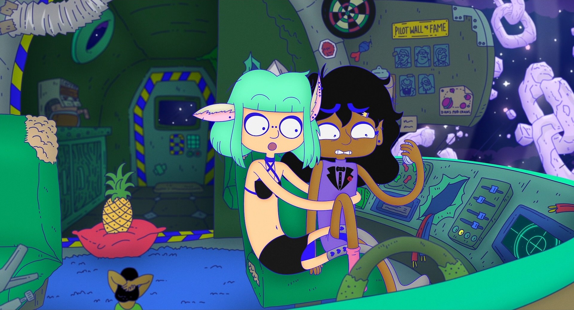 A cartoon depicting the interior of a rundown, grubby little space craft. Two women with brightly coloured hair and noodly legs are cuddling on the pilots chair.