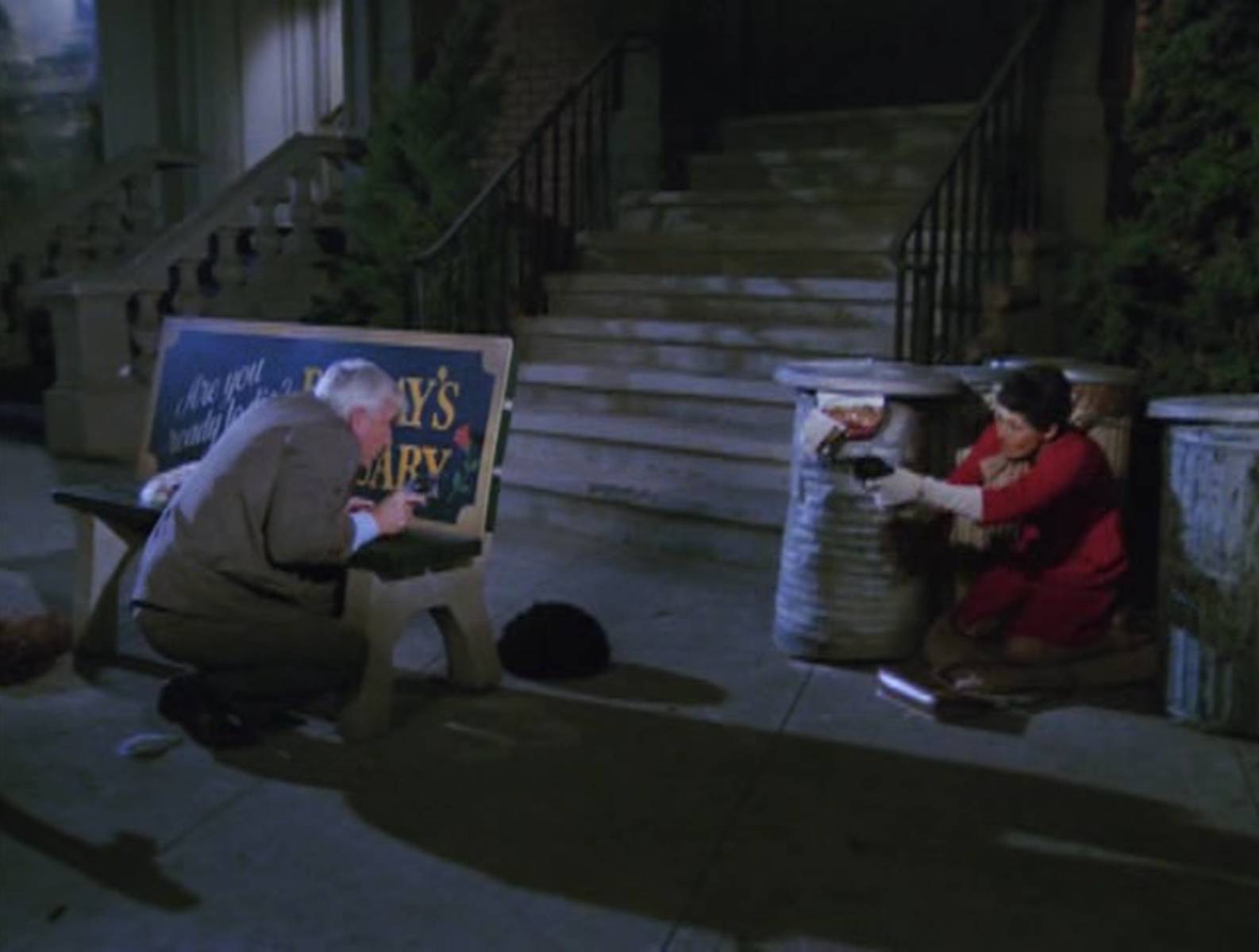 A scene from the tv show Police Squad. A man and a woman in a shoot out, both hiding behind cover and shooting at each other. They are about a metre apart.